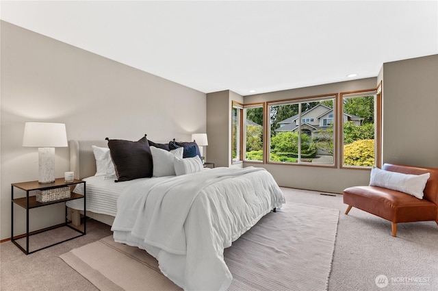 carpeted bedroom with recessed lighting