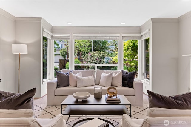 living room featuring light carpet, ornamental molding, and recessed lighting