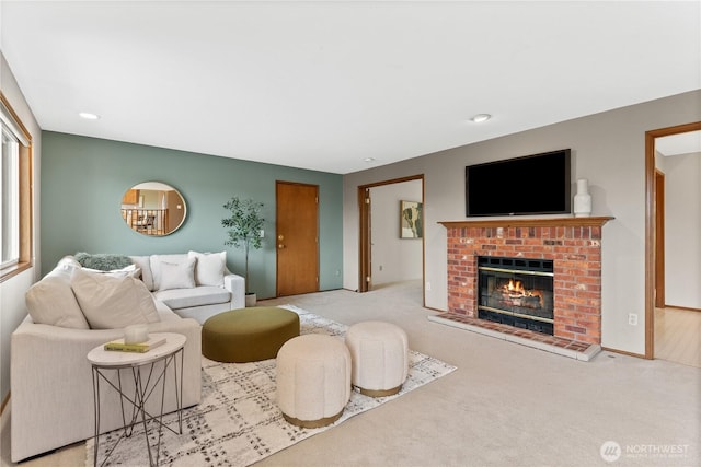 carpeted living room with a fireplace and recessed lighting