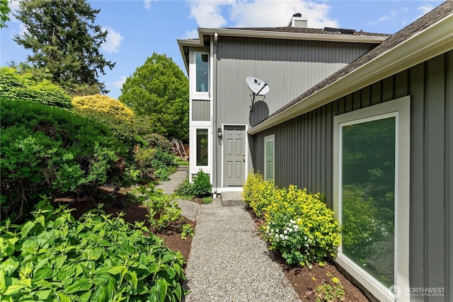 property entrance with a chimney