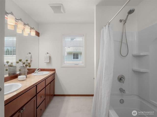 1206 S 36th Pl, Renton, WA 98055 - bathroom with plenty of natural light, shower / bath combo, double vanity, and baseboards