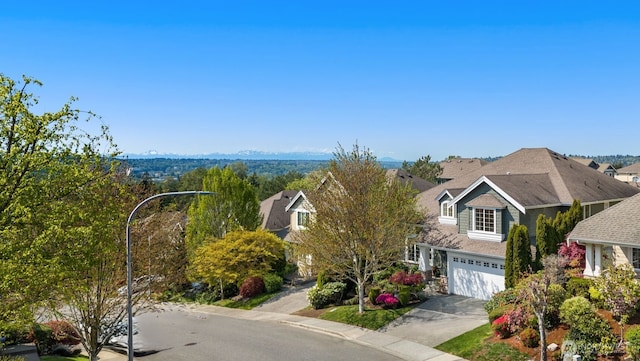 1206 S 36th Pl, Renton, WA 98055 - view of front facade with driveway and an attached garage