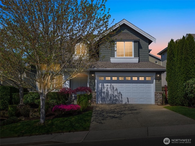 1206 S 36th Pl, Renton, WA 98055 - view of front of property featuring a garage, stone siding, concrete driveway, and roof with shingles
