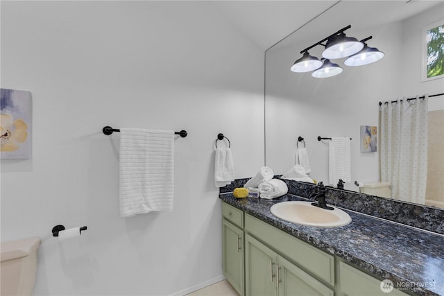 21827 4th Ave SE, Bothell, WA 98021 - full bath with toilet, vanity, vaulted ceiling, and baseboards