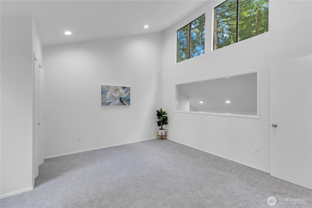 21827 4th Ave SE, Bothell, WA 98021 - spare room with recessed lighting, carpet, baseboards, and a high ceiling