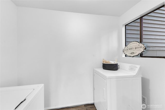 21827 4th Ave SE, Bothell, WA 98021 - laundry room featuring washing machine and clothes dryer, wood finished floors, and baseboards