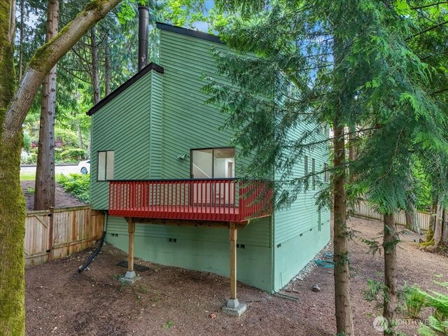 21827 4th Ave SE, Bothell, WA 98021 - back of house featuring crawl space, a wooden deck, and fence