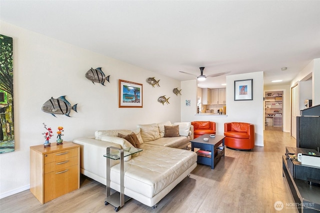 6910 California Ave SW Unit 26, Seattle, WA 98136 - living area with light wood-style floors, baseboards, and a ceiling fan