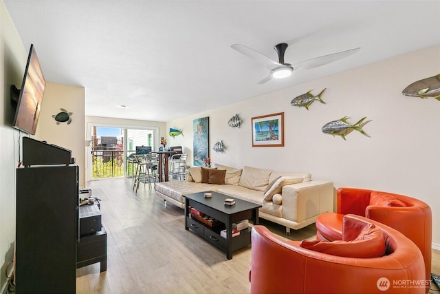 6910 California Ave SW Unit 26, Seattle, WA 98136 - living area with light wood finished floors and a ceiling fan