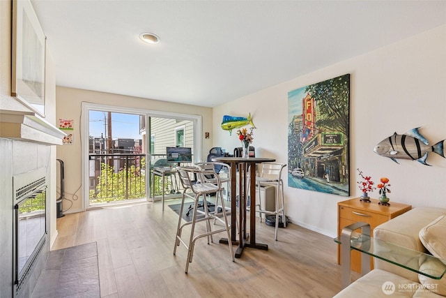 6910 California Ave SW Unit 26, Seattle, WA 98136 - dining area featuring baseboards and wood finished floors