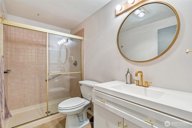 6910 California Ave SW Unit 26, Seattle, WA 98136 - full bathroom with a stall shower, vanity, and toilet