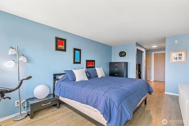 6910 California Ave SW Unit 26, Seattle, WA 98136 - bedroom featuring baseboards and wood finished floors