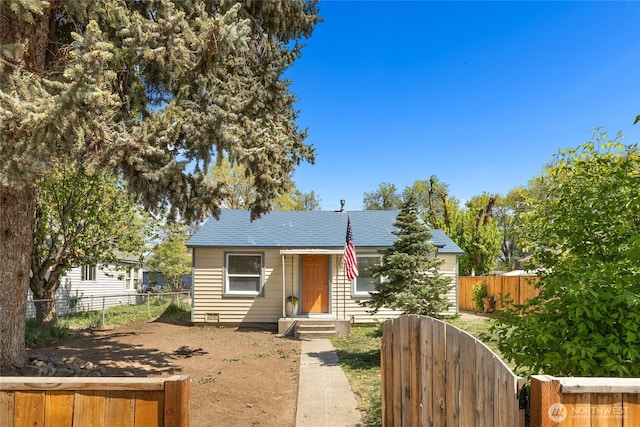 bungalow-style home featuring fence private yard