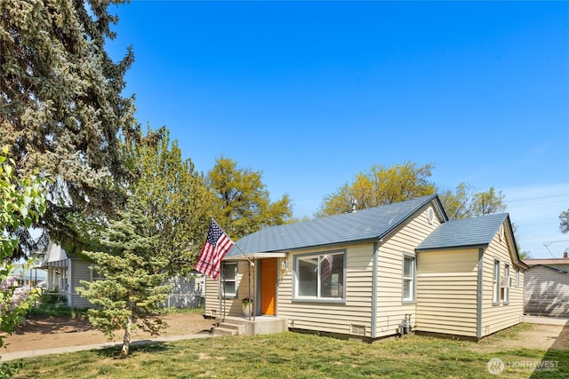 bungalow-style house with a front yard