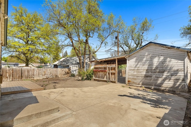 view of patio featuring fence