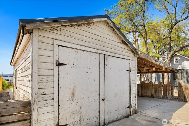 view of shed with fence