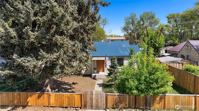 obstructed view of property with a gate and fence private yard