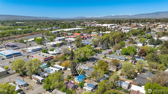 drone / aerial view featuring a residential view and a mountain view