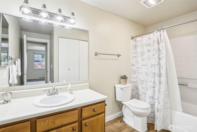 16817 Larch Way Unit B202, Lynnwood, WA 98037 - full bath featuring visible vents, vanity, wood finished floors, shower / bath combination with curtain, and toilet