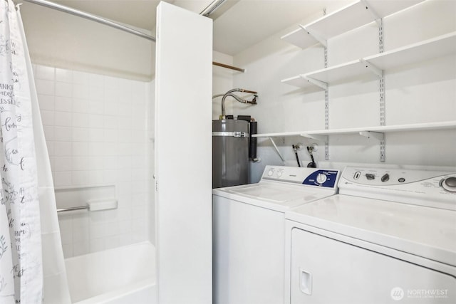 16817 Larch Way Unit B202, Lynnwood, WA 98037 - clothes washing area featuring secured water heater, separate washer and dryer, and laundry area