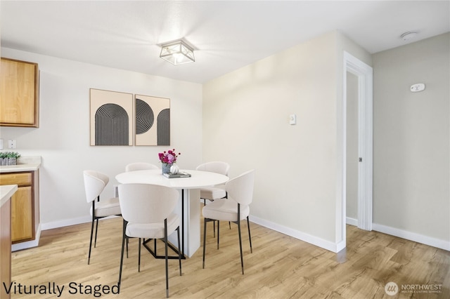 16817 Larch Way Unit B202, Lynnwood, WA 98037 - dining space featuring baseboards and light wood-style flooring