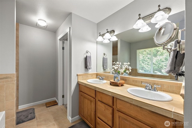 13211 174th St E, Puyallup, WA 98374 - full bathroom with double vanity, tile patterned floors, and baseboards