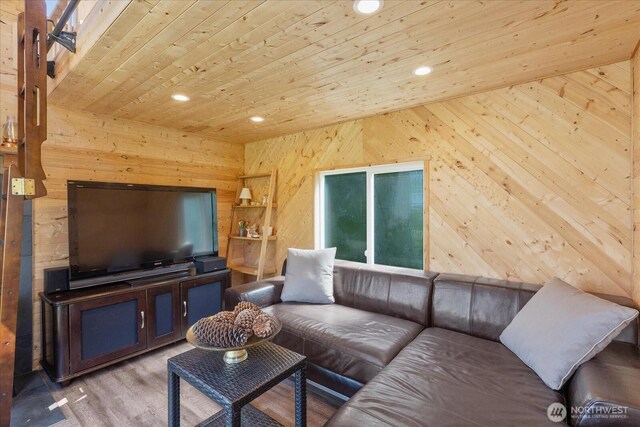 living room featuring wooden ceiling, wooden walls, recessed lighting, and wood finished floors