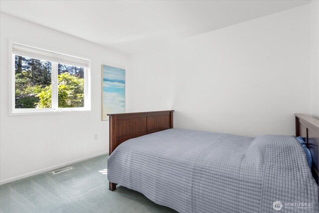 carpeted bedroom with baseboards
