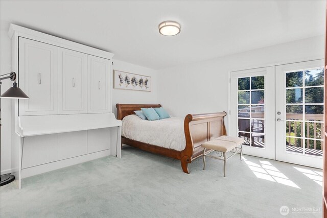 bedroom with french doors, access to exterior, and carpet floors