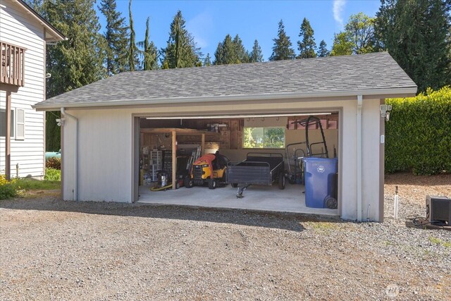 detached garage featuring central air condition unit
