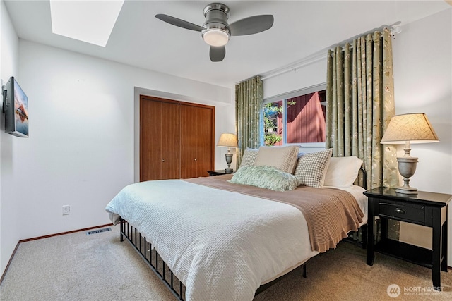 604 128th Ave SE, Bellevue, WA 98005 - bedroom with visible vents, a closet, baseboards, carpet, and a skylight