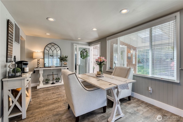 dining room featuring wood finished floors, recessed lighting, and baseboards
