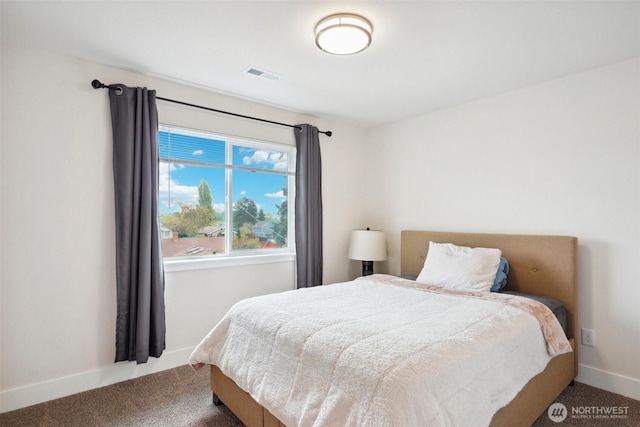 carpeted bedroom with visible vents and baseboards