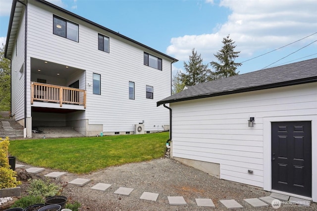 back of house with a lawn and crawl space