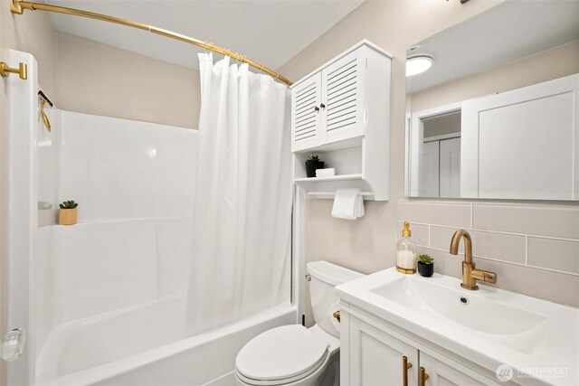1 Morning Beach Dr Unit 26, Bellingham, WA 98229 - full bathroom featuring toilet, shower / tub combo, vanity, and tasteful backsplash