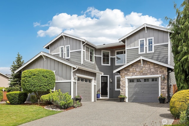 25510 SE 275th Pl, Maple Valley, WA 98038 - view of front of home with board and batten siding, an attached garage, and asphalt driveway