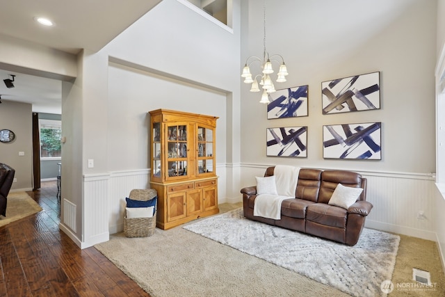 25510 SE 275th Pl, Maple Valley, WA 98038 - living area featuring a wainscoted wall, hardwood / wood-style flooring, and a chandelier