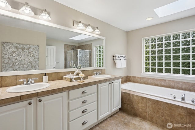 25510 SE 275th Pl, Maple Valley, WA 98038 - full bath featuring a skylight, a stall shower, double vanity, a garden tub, and tile patterned flooring