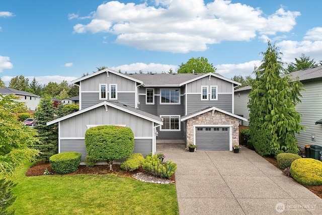 25510 SE 275th Pl, Maple Valley, WA 98038 - view of front of house featuring board and batten siding, driveway, stone siding, and a front yard