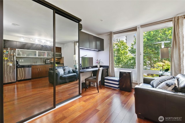4547 8th Ave NE Unit 308, Seattle, WA 98105 - living area featuring bar area and wood-type flooring
