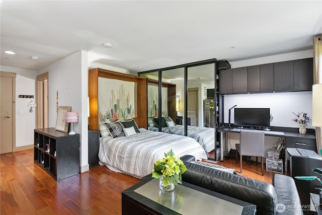 4547 8th Ave NE Unit 308, Seattle, WA 98105 - bedroom featuring recessed lighting and dark wood-style floors