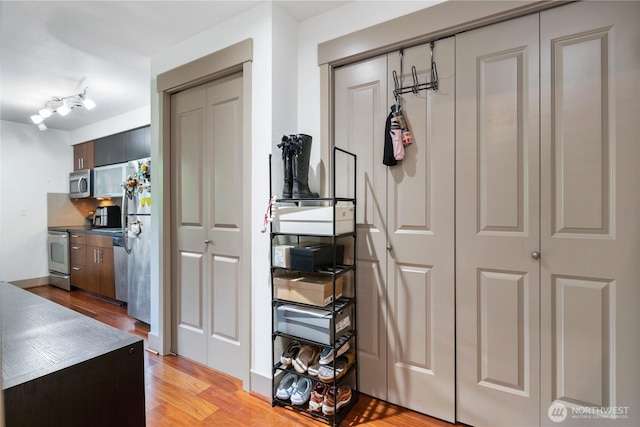 4547 8th Ave NE Unit 308, Seattle, WA 98105 - hallway featuring light wood-style floors