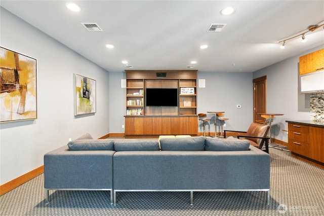 4547 8th Ave NE Unit 308, Seattle, WA 98105 - living room with baseboards, visible vents, and carpet floors