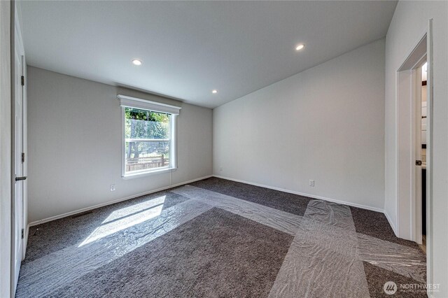 spare room featuring baseboards, recessed lighting, and carpet