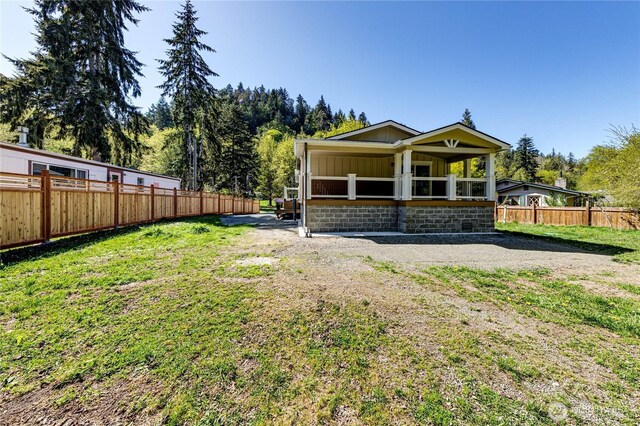 exterior space with fence and board and batten siding