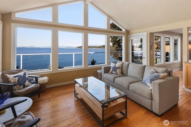 192 Fay Ln, Camano Island, WA 98282 - living room with light wood-style floors, a water view, and plenty of natural light