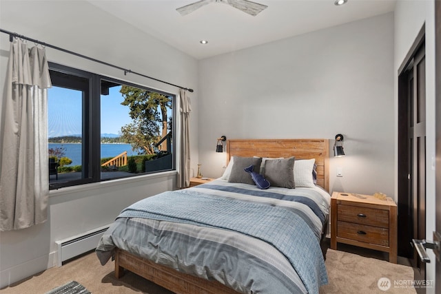 192 Fay Ln, Camano Island, WA 98282 - carpeted bedroom with a water view, baseboard heating, and recessed lighting