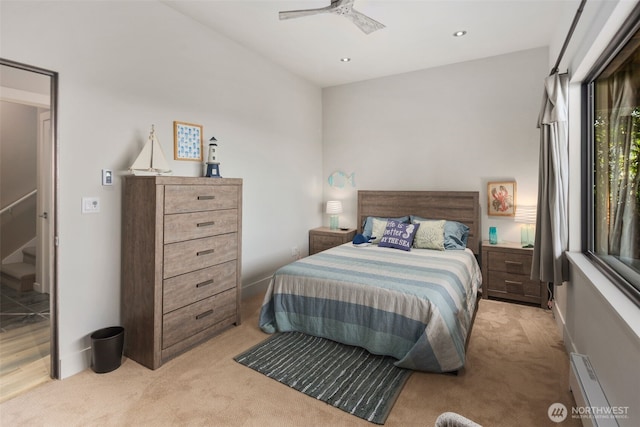 192 Fay Ln, Camano Island, WA 98282 - bedroom with baseboard heating, a ceiling fan, recessed lighting, and light colored carpet