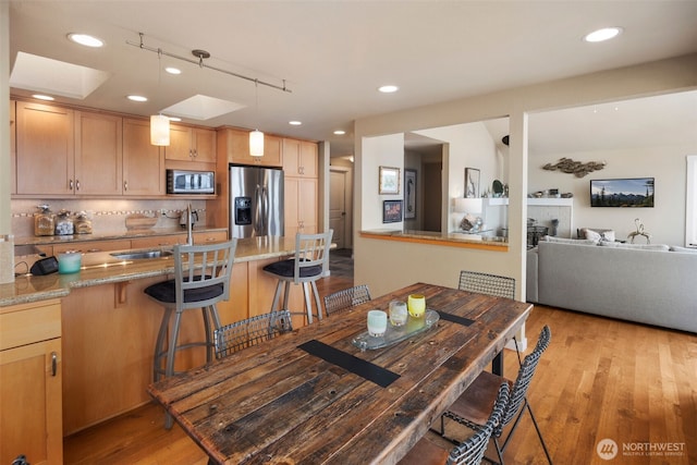 192 Fay Ln, Camano Island, WA 98282 - dining space featuring light wood-style floors, a fireplace, and recessed lighting