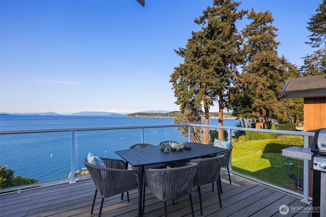 192 Fay Ln, Camano Island, WA 98282 - wooden deck featuring outdoor dining space and a water and mountain view
